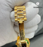 Close-up of the concealed folding Crownclasp on a Rolex Day-Date 36 yellow gold diamond watch, highlighting the seamless finish.