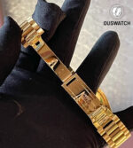 Detailed look at the Rolex President bracelet on the Day-Date 36, showing the signature folding clasp in 18k yellow gold.