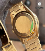 Rear view of the Rolex Day-Date 36 model 128348RBR, featuring a diamond bezel and solid caseback in polished yellow gold.