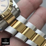 Detail close-up of the yellow gold and Oystersteel links on the Rolex 126333 bracelet, showing the fine brushing and polishing.