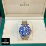 Rolex Submariner Date 126613LB centered inside its presentation watch box.