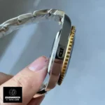 Side profile of the Rolex Submariner 126613LB case showcasing the polished bevels and case thickness.