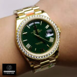Wrist shot of Rolex 228348RBR President yellow gold watch worn on wrist, styling and fit.