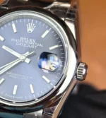 Close-up of the stainless steel case on Rolex Datejust 126200-0006 blue dial.