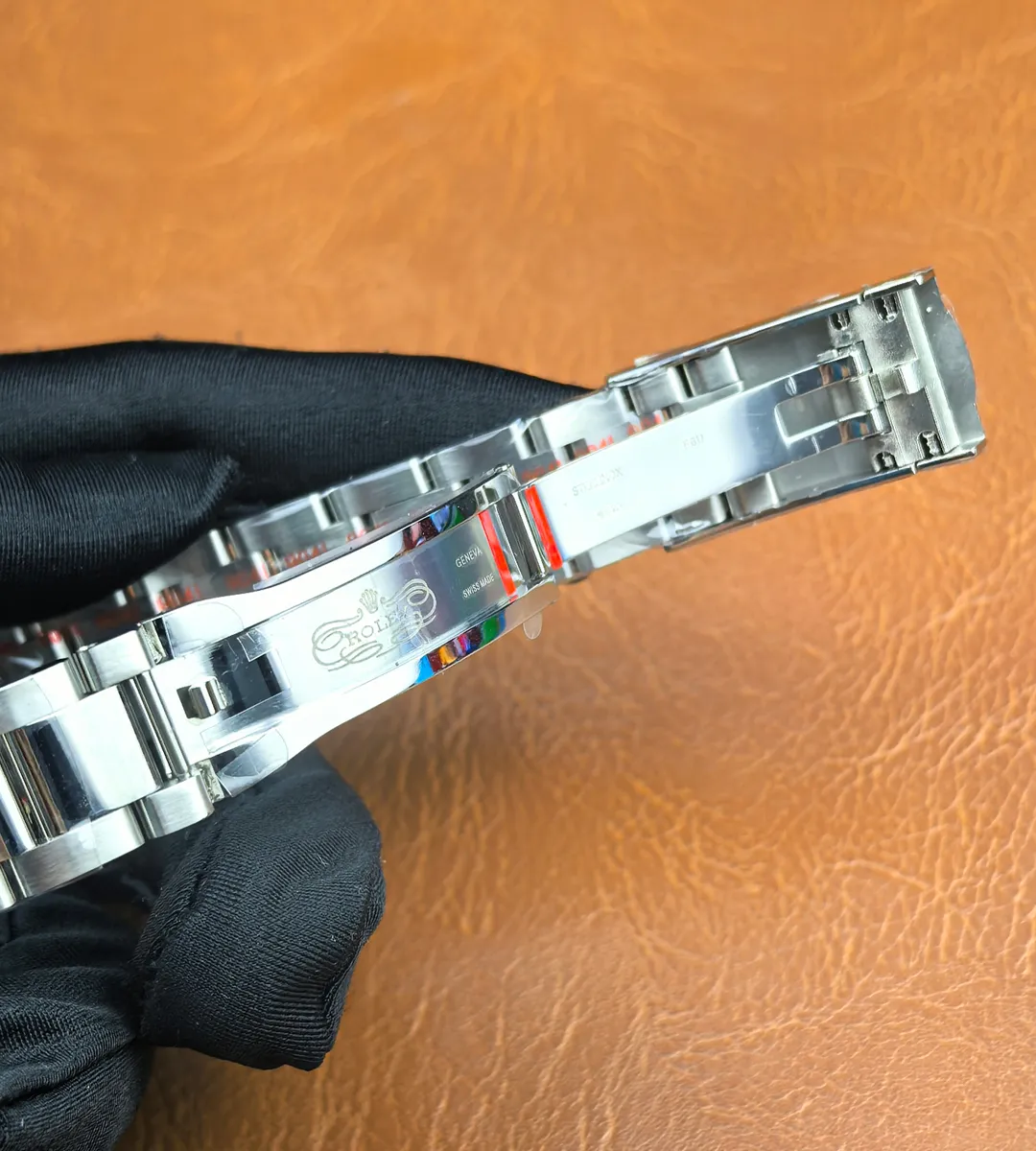 Rolex Datejust 126200-0006 folding clasp fully unfolded, showing locking mechanism and construction.