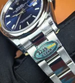 Inner detail of the folding clasp on Rolex Datejust 126200-0006, showing engraving and finish.