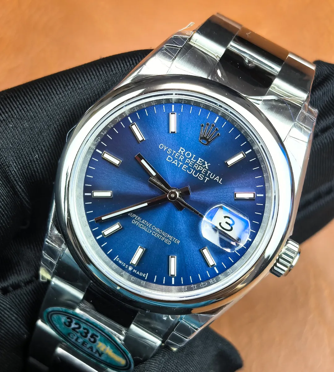 Rolex Datejust 36mm 126200-0006 blue dial shown at a 45° angle, highlighting case and dial.