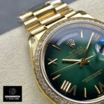 Close detail of Rolex 228348RBR diamond bezel and green ombre dial, highlighting gem setting and finish.
