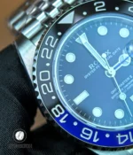 Close-up of bezel serration and dial texture on the 126710BLNR, showing finish and lume plots.