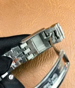 Interior structure of the stainless steel clasp on the GMT-Master II 126710BLNR showing construction and locking elements.
