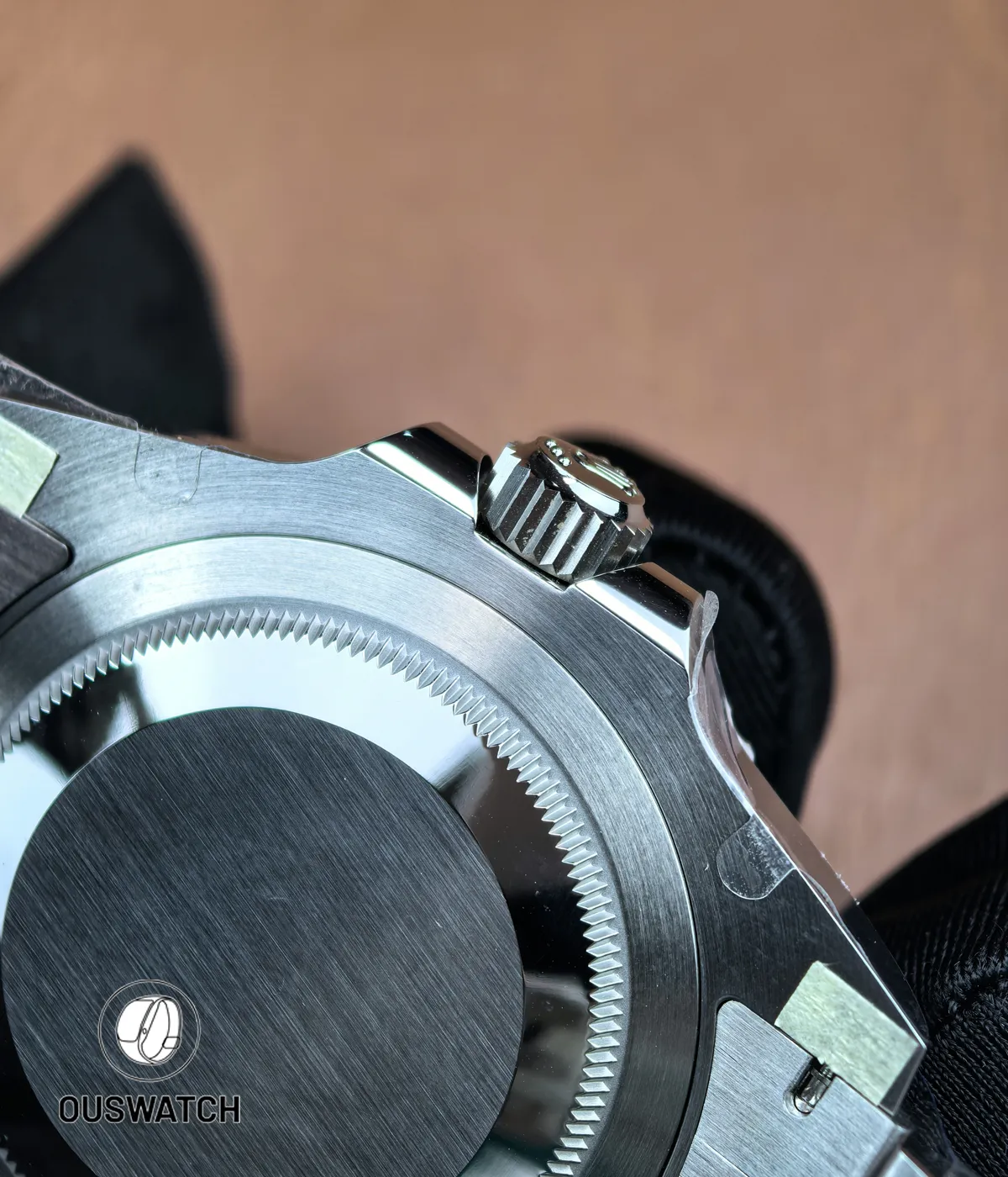 Combined close-up of the screw-down crown and caseback on the 126710BLNR, highlighting fine machining details.