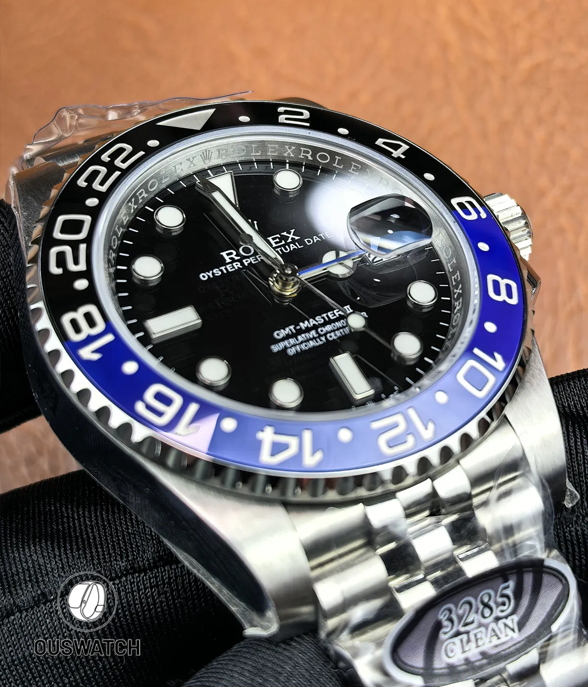 Full-frame shot focusing on the blue and black ceramic bezel of the Rolex GMT-Master II Batgirl.
