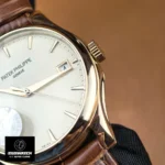 Detailed shot of the rose gold case finishing and bevels on Patek Philippe Calatrava 5227R-001.