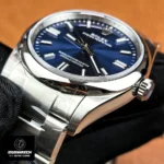 Tight shot of the stainless-steel case flank showing satin brushing, polished chamfer and machining precision.