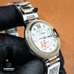 Cartier Ballon Bleu 33mm rose gold women's watch — 110-degree side view showing case thickness and crown guard.