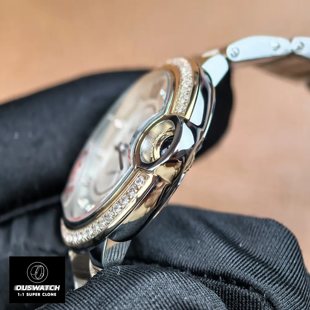 Close-up of the satin-finished crown on Cartier Ballon Bleu 33mm rose gold women's watch.