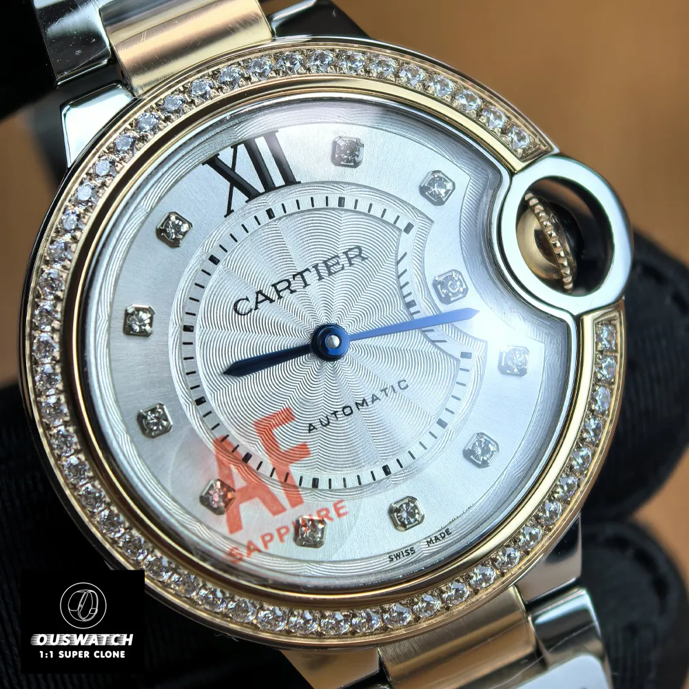 Detailed view of diamond bezel and silver dial on Cartier Ballon Bleu 33mm rose gold women's watch.