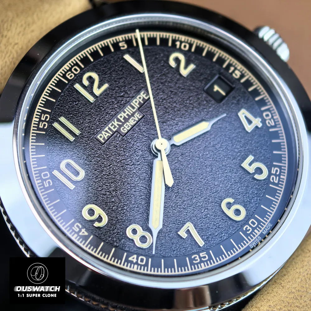 Close-up showing the textured black dial of the Patek Philippe Calatrava 5226G-001 — numerals and hands highlighted.