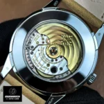 Close-up of the movement inside the Patek Philippe Calatrava 5226G-001 — rotor, bridges and Geneva stripes visible.