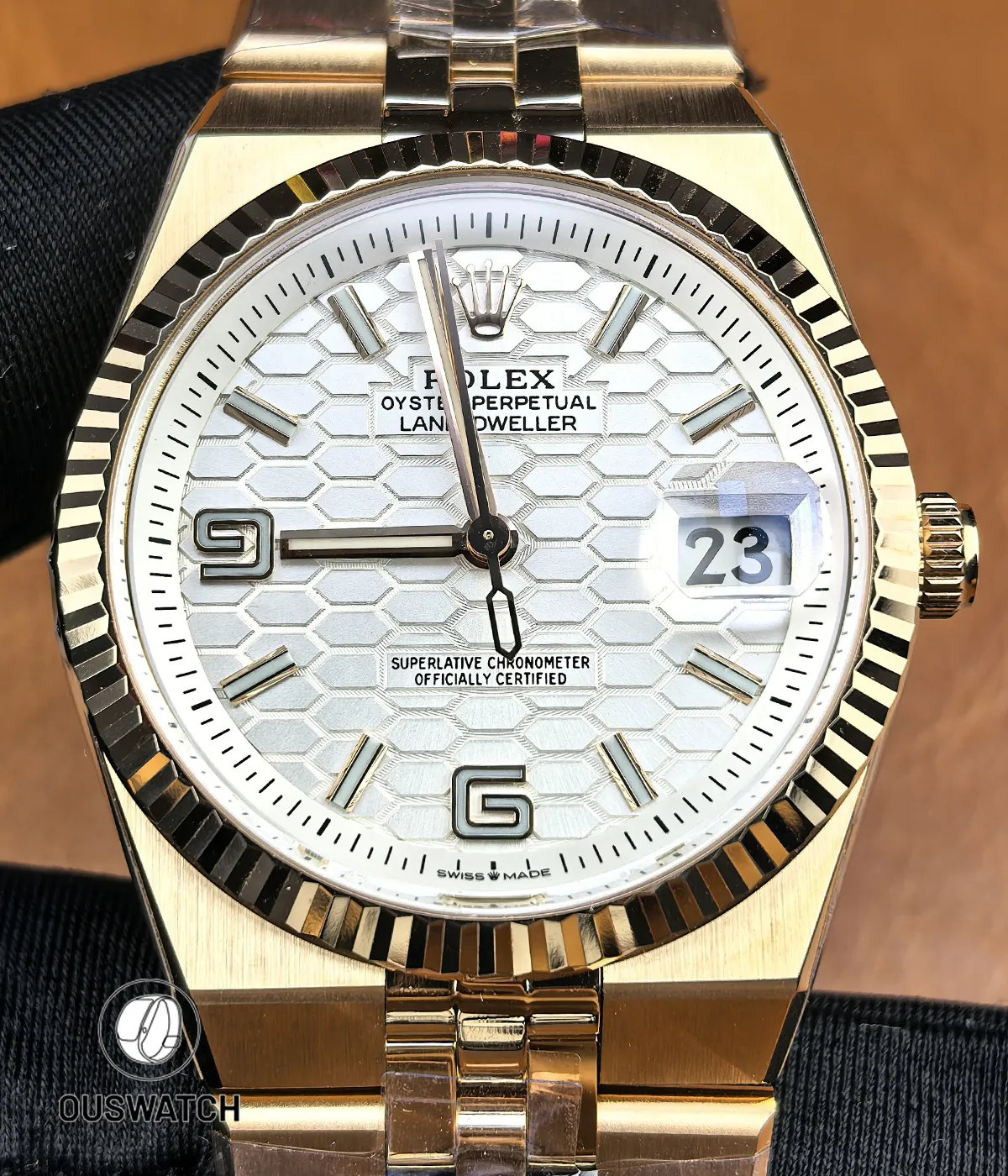 Front view of Rolex Land-Dweller 127335-0001 in rose gold showing dial, hands, and hour markers.