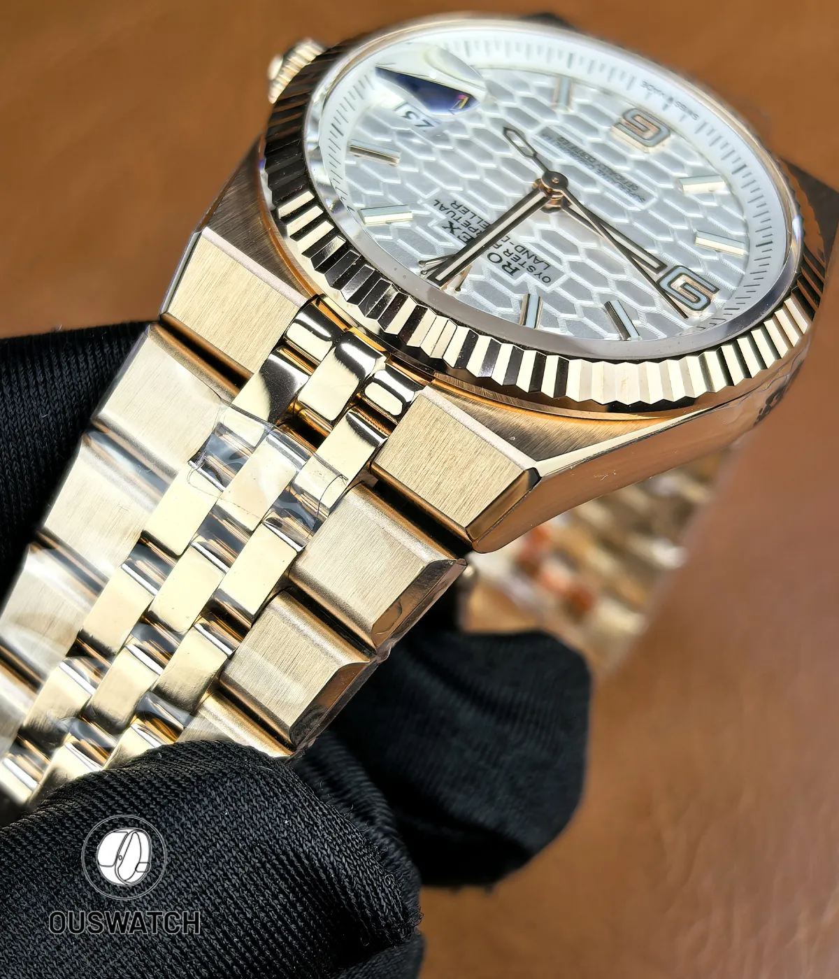 Close-up of the lugs and bracelet connection on Rolex Land-Dweller 127335-0001 showing fit and finish.