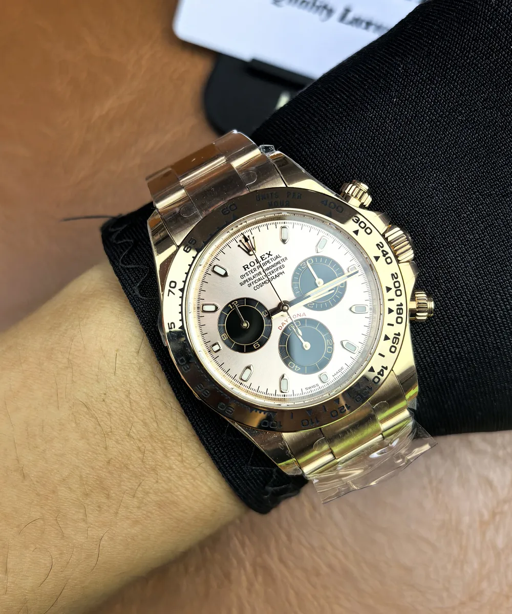 Rolex Daytona 116505 rose gold female super clone shown worn on a wrist.