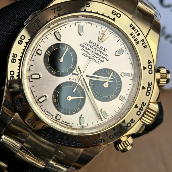 Close-up of the Sundust and black dial variants on the Rolex Daytona 116505 rose gold female super clone.