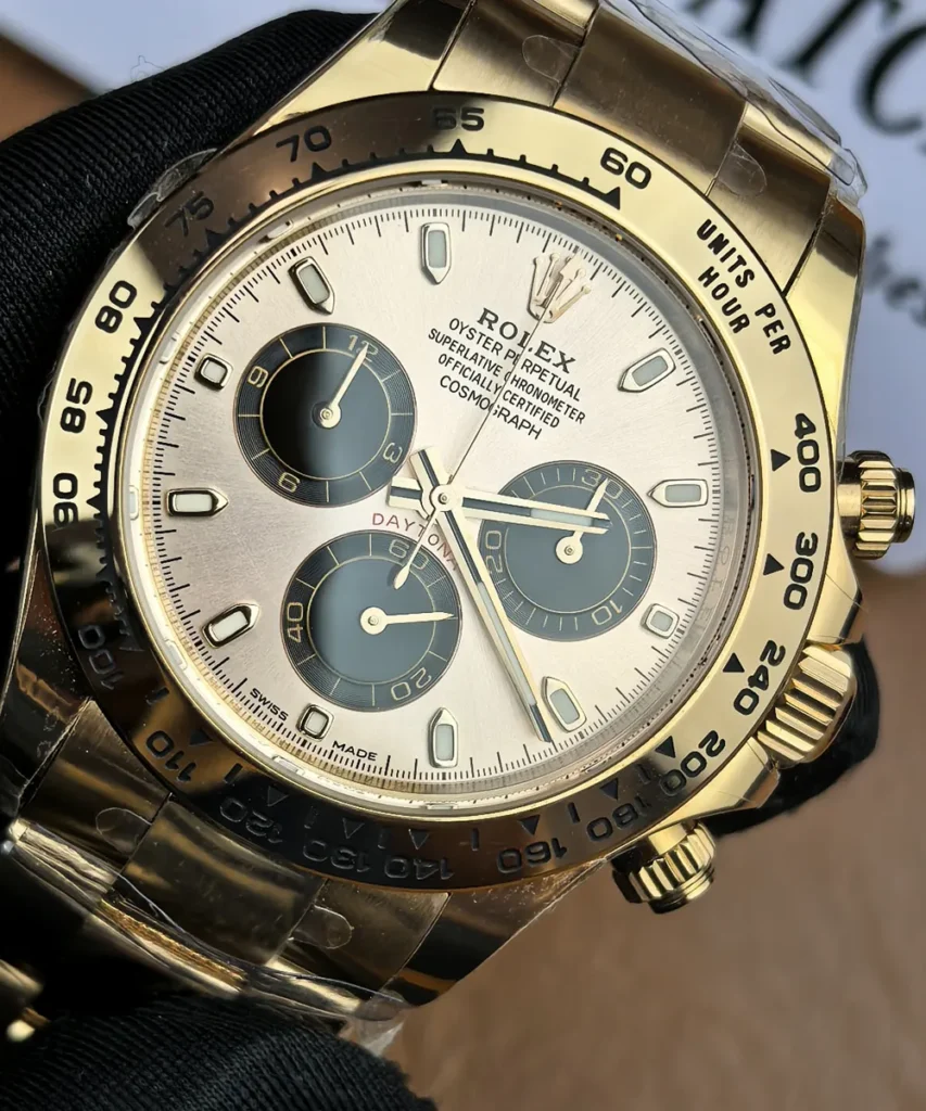 Close-up of the Sundust and black dial variants on the Rolex Daytona 116505 rose gold female super clone.