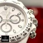 Tight detail of the bezel edge and adjacent chronograph pushers on the Rolex Custom Daytona Panda