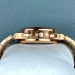 Side profile of the 5990/1R Nautilus highlighting the crown, pushers, and case thickness.