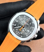 45-degree angled shot focused on the Aquanaut 5968A black dial with orange highlights.