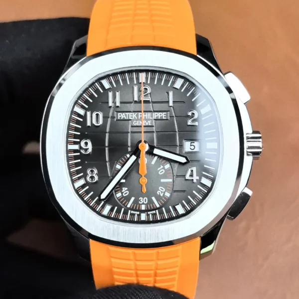 Front-facing image of the Aquanaut 5968A showing the black dial, orange accents, and overall design.