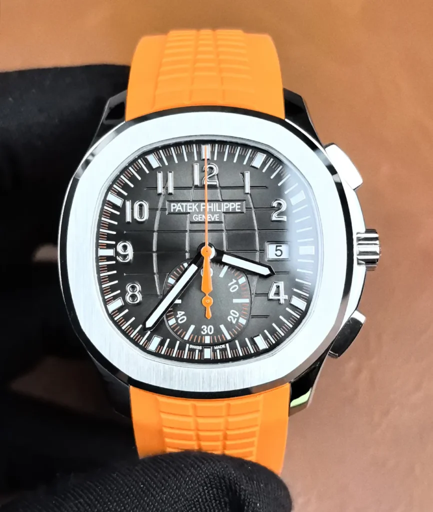 Front-facing image of the Aquanaut 5968A showing the black dial, orange accents, and overall design.