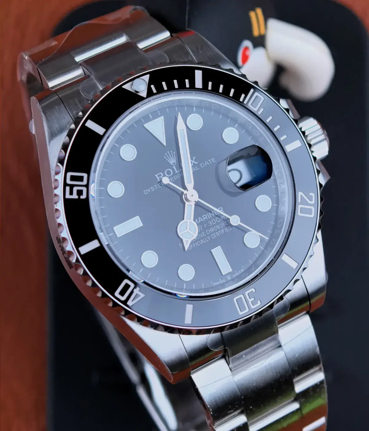 Front view of the Rolex Submariner 126610LN black dial watch at a 110-degree angle