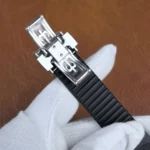 Detailed view of the black rubber strap of the Patek Philippe 5968A-001, showing texture and flexibility