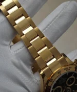 Detail view of the bracelet on the Rolex 126508 Daytona yellow gold watch.