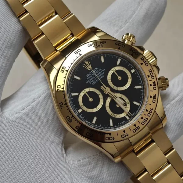 Close-up view of the black dial on the Rolex 126508 Daytona yellow gold watch.