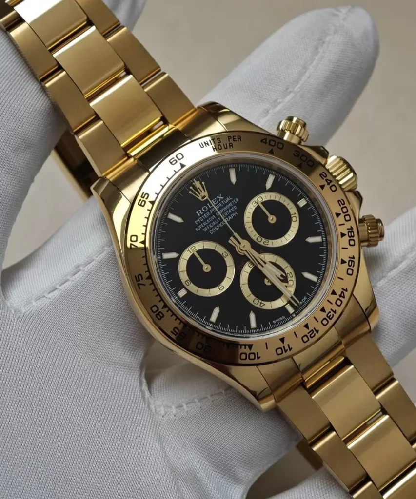 Close-up view of the black dial on the Rolex 126508 Daytona yellow gold watch.