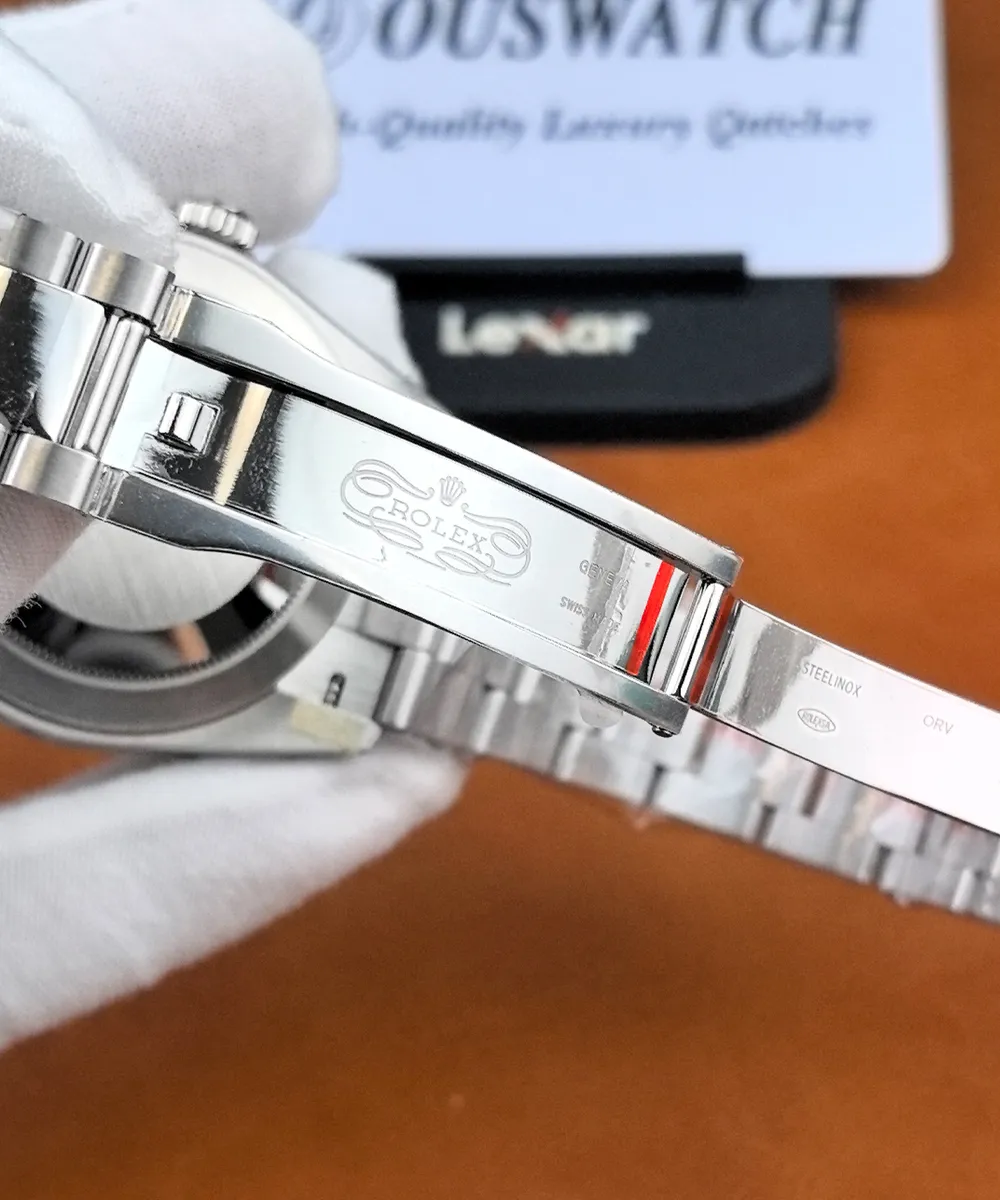Inside view of the Rolex Datejust 126300 Oyster bracelet clasp, showing the polished metal surface and Rolex engravings.