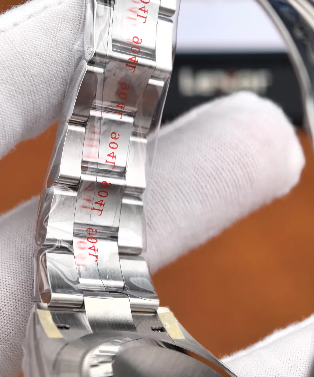 Underside close-up of the Rolex Datejust 126300 Oyster bracelet, showing the steel links, protective film, and brushed finishing.